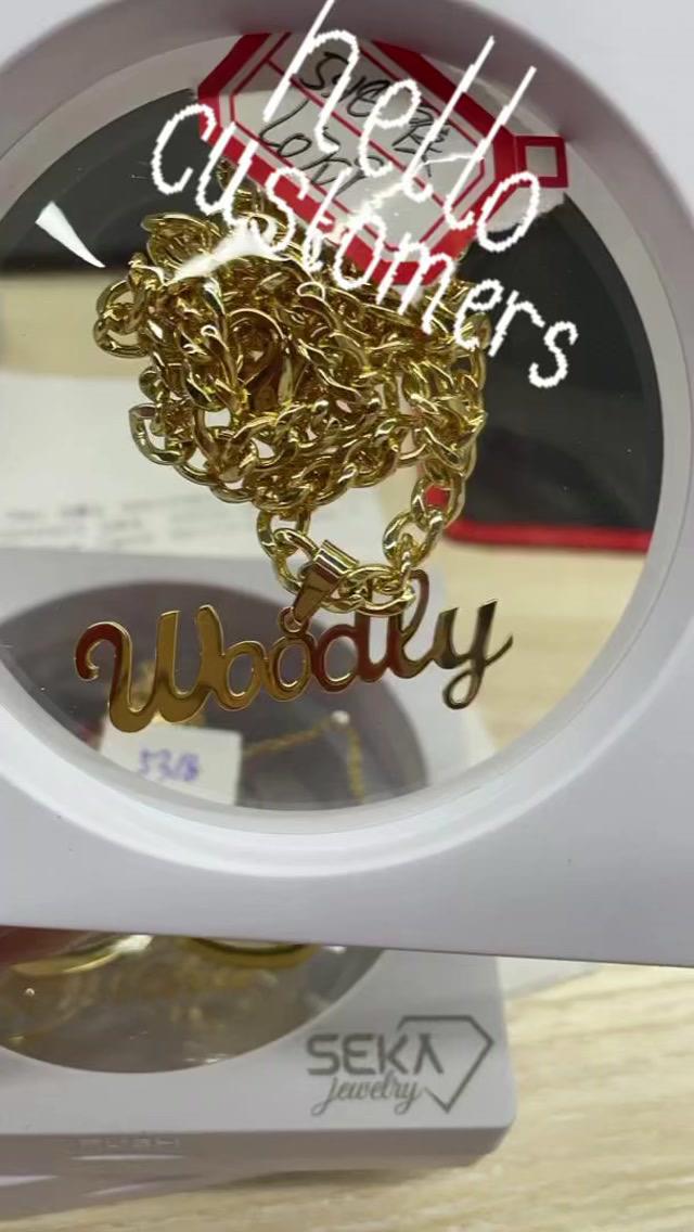 Gold name pendant on a cuban chain