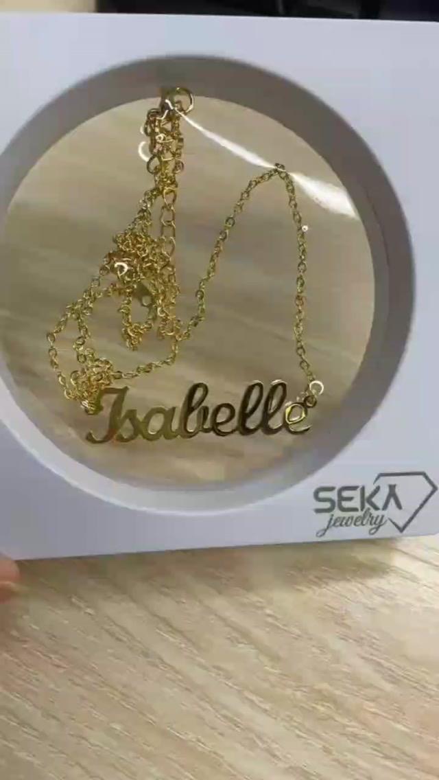Gold script name necklace in a round gift frame