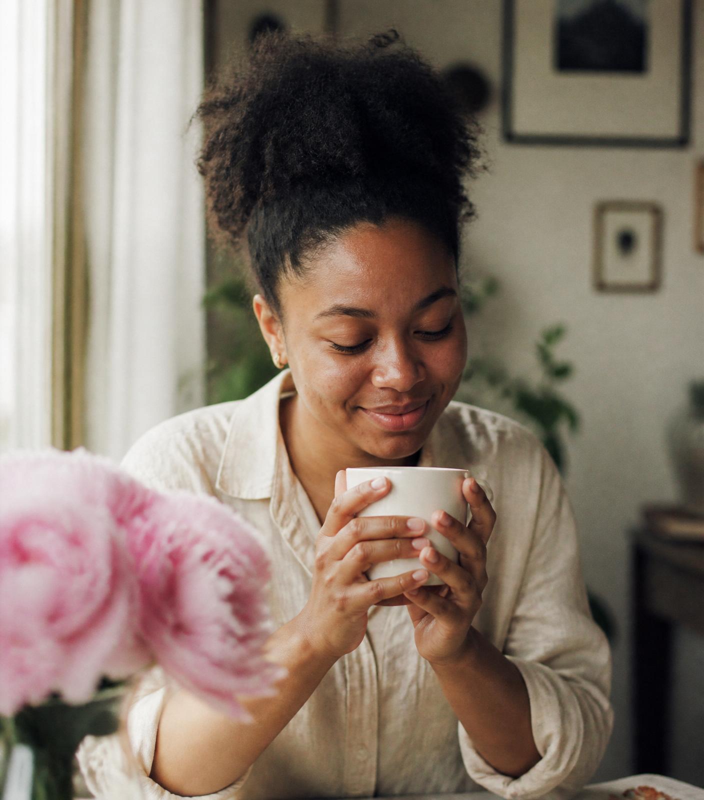 Personalized photo mug on a linen table with peonies